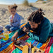 Father and daughter on the beach with an Adventure Sheet from Grand Trunk