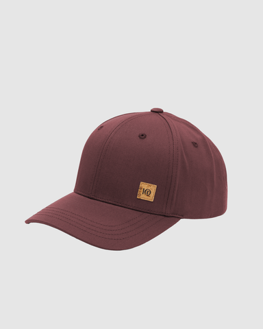 A maroon baseball cap with a small tan leather patch on the side featuring the '10' logo, shown against a light gray background.