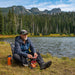 Man sitting in the wilderness in his Mayfly Chair from Grand Trunk