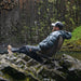 Man sitting in a very rocky terrain in his Mayfly Chair